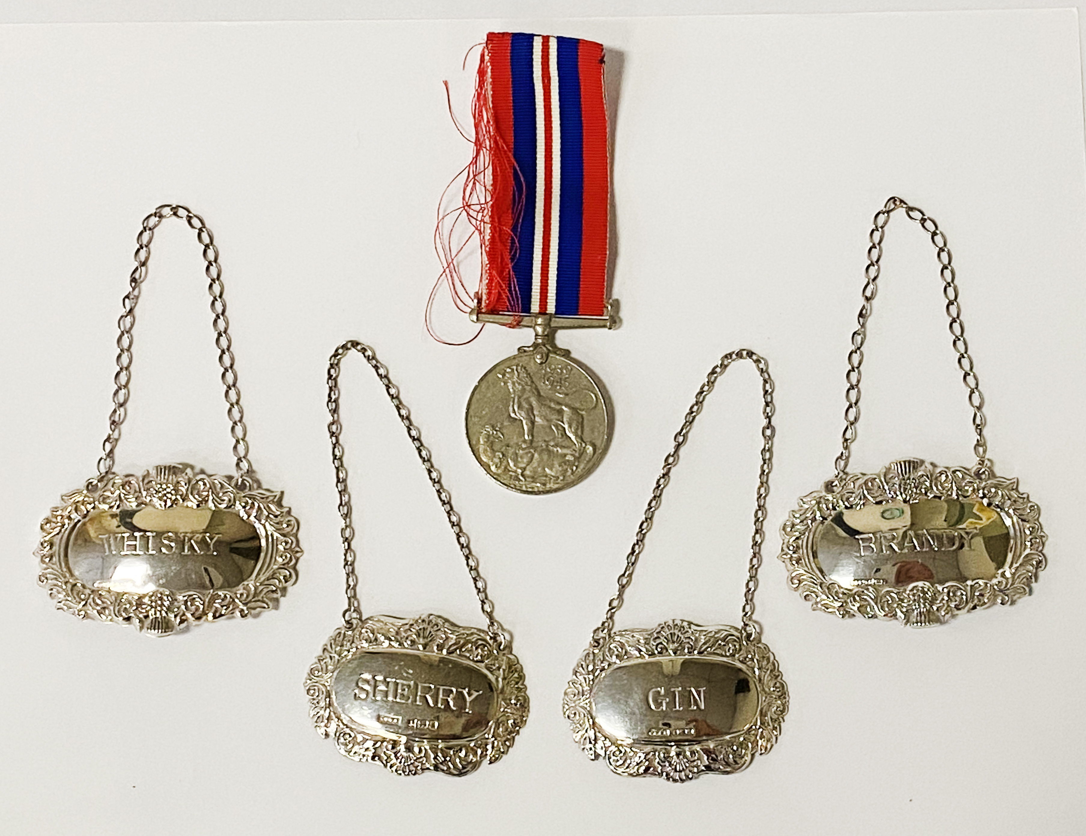 MILITARY MEDAL & 4 SILVER DECANTER LABELS