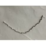 BOXED 9CT WHITE GOLD & CZ BRACELET RETAILED BY BEAVER BROOKS - 9.6 GRAMS APPROX