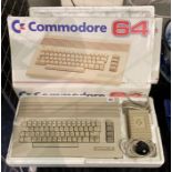 2 BOXED COMMODORE 64S