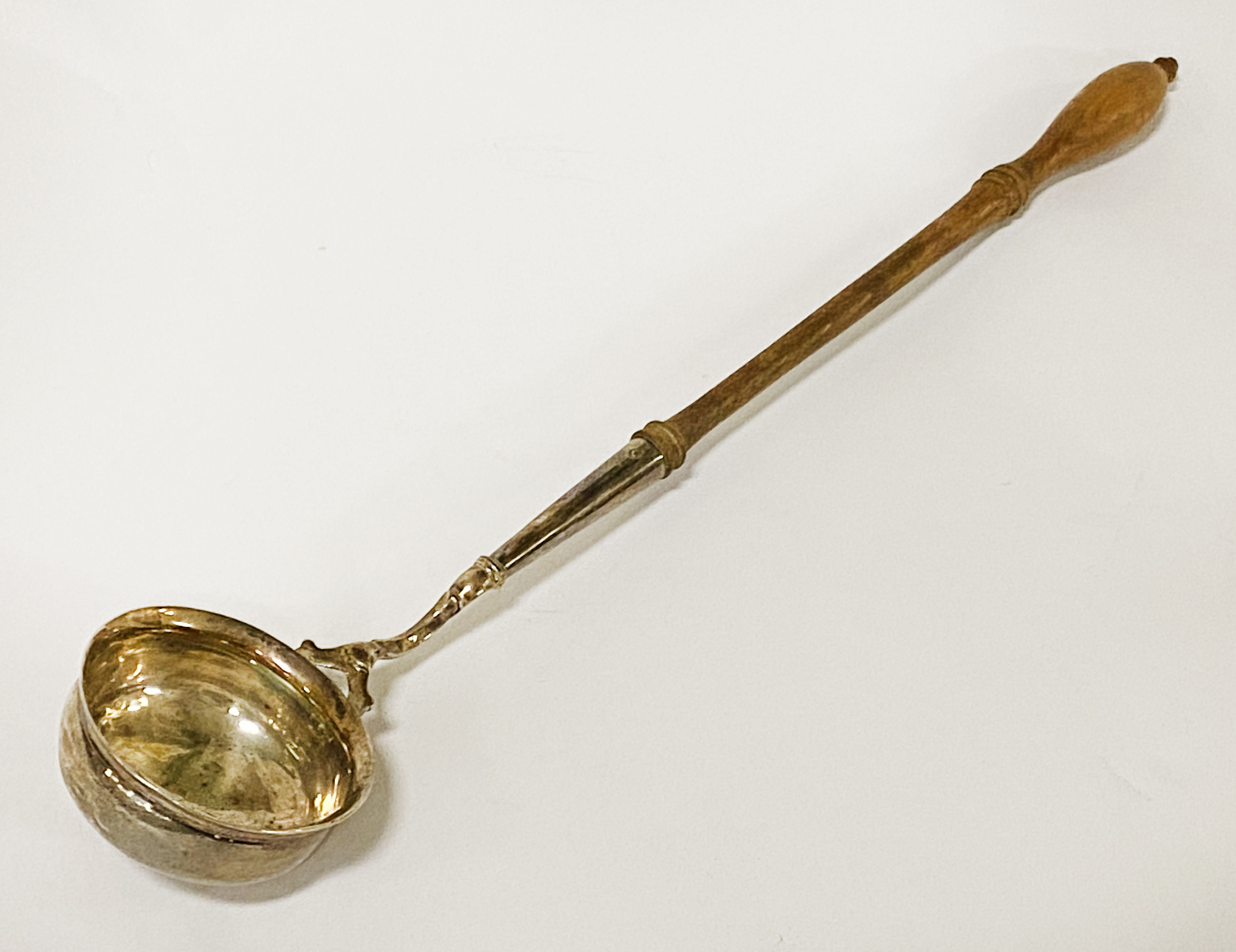 GEORGIAN SILVER WINE LADLE WITH A SMALL DENT TO THE SIDE