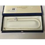 18 CARAT GOLD CLASPED PEARL NECKLACE - 16'' LENGTH