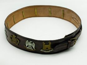 VINTAGE LEATHER BELT WITH MILITARY CAP BADGES