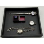 WATCH AND LOCKET AND CHAIN AMONG WITH A BUTTON HOOK ALL SILVER AND A A RING