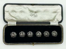 AN ANTIQUE SET OF SIX HALLMARKED SILVER BUTTONS CASED