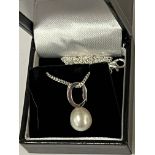 STERLING SILVER CULTURED PEARL PENDENT WITH CHARM