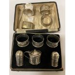 H/M SILVER 6 PIECE CRUET SET WITH 4 HM SILVER NAPKIN RINGS