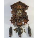 A German carved softwood cuckoo wall clock, with Regula, West Germany movement and Swiss Musical