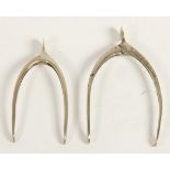 Asprey, a silver wishbone sugar tongs, by Aspreys, London 1905 and another similar pair, by