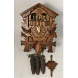 A German carved softwood cuckoo wall clock, with Regula, West Germany movement and Swiss Musical