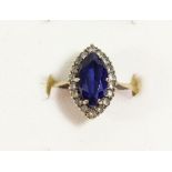 A 9ct gold blue and white paste navette cluster ring, K, 3gm