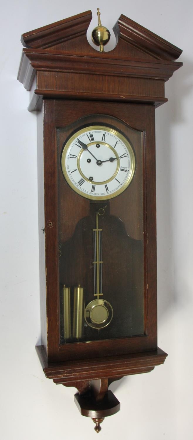A mahogany Vienna style wall clock, the three train movement by Franz Hermie, striking/playing on