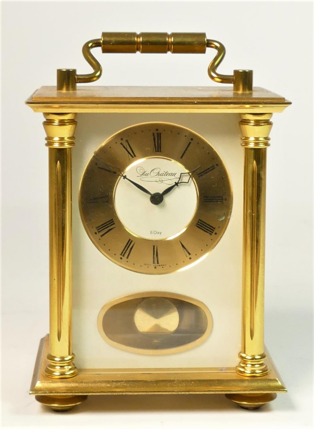 A Du Chateau West German 8 day brass carriage clock, striking on a bell, gilt dial with Roman