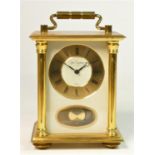 A Du Chateau West German 8 day brass carriage clock, striking on a bell, gilt dial with Roman