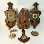 Two mid 20th century mahogany Dutch wall clocks together with a large quartz cuckoo clock, and three