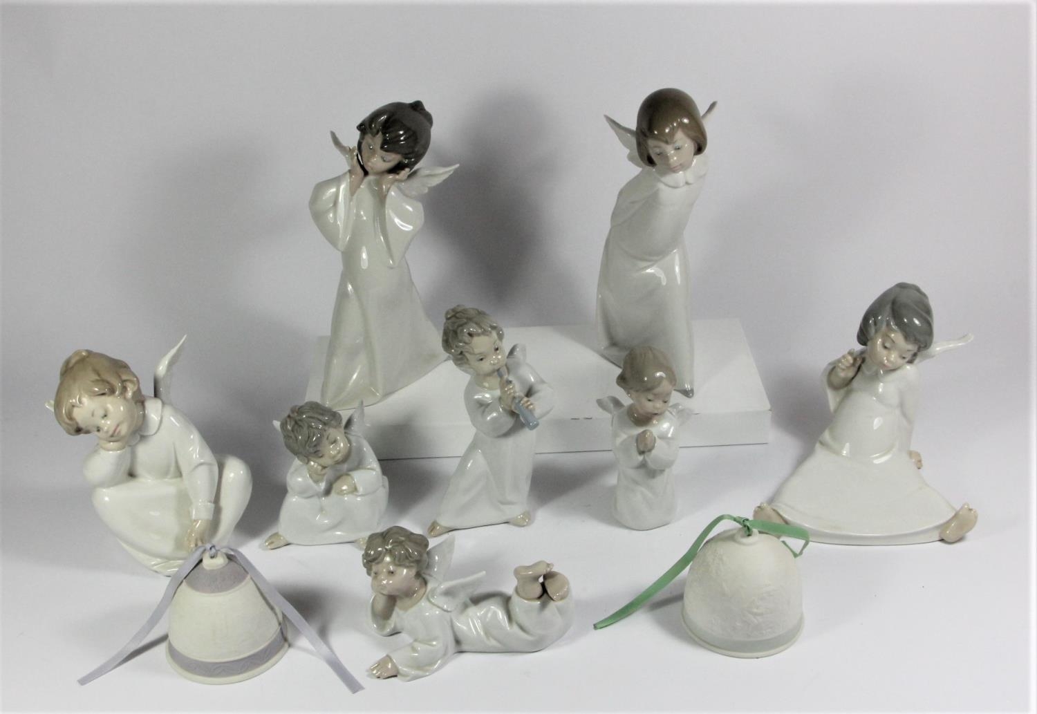 A collection of 8 Lladro figurines to include, Mime Angel 23cm, Curious Angel 24cm, Angel