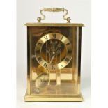 A German brass mantle clock with Roman numeral dial, with pendulum, 19cm