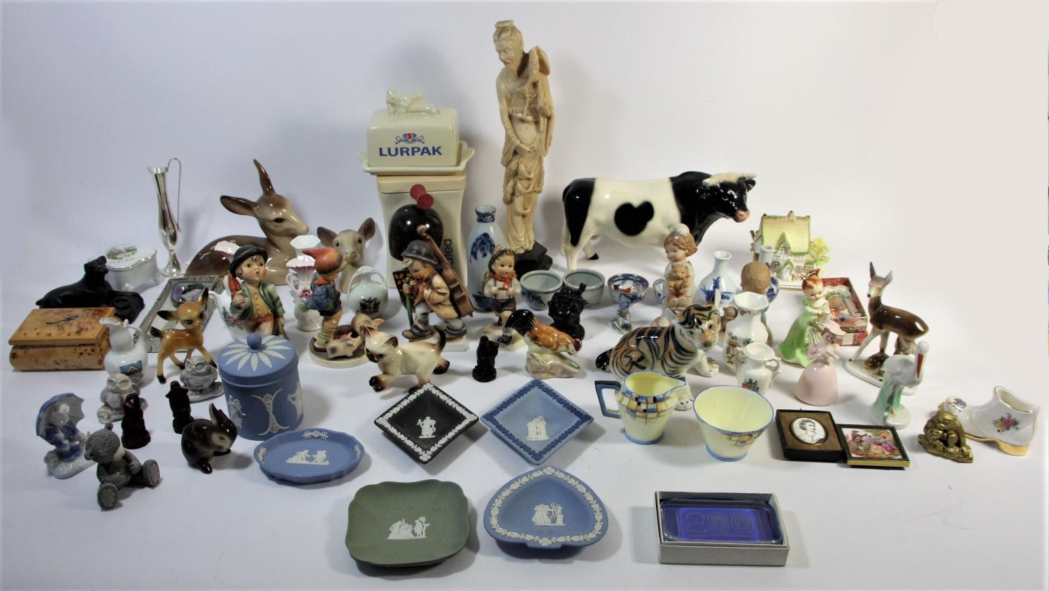 A collection of ceramics to include, Hummel figurines, Wedgewood Jasperware, Coalport cottage,