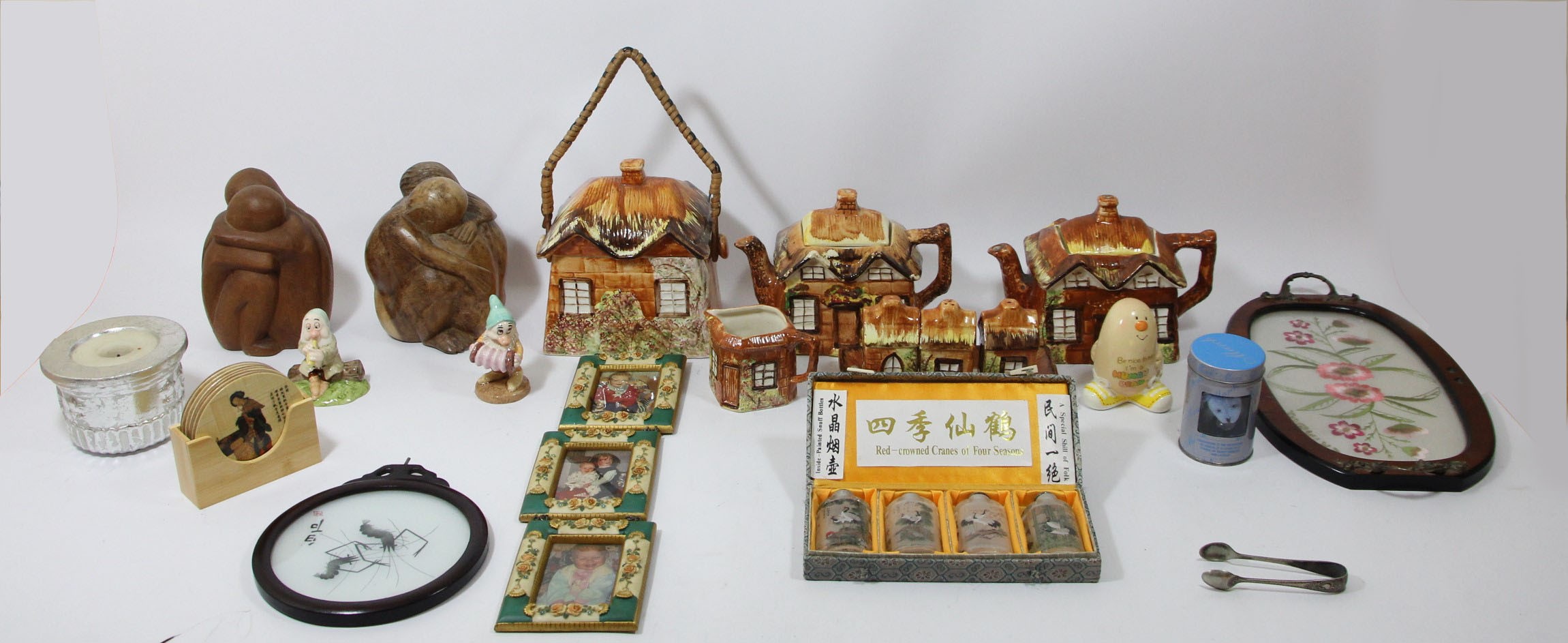 A collection of ceramic models of dogs and other animals, together with a five piece cottage ware