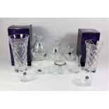 A collection of six Stuart crystal pieces to include vases and trinket bowls together with two