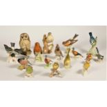 A collection of model birds, to include a Goebel Robin, a Blue Tit, a Brambling, a Goldfinch,