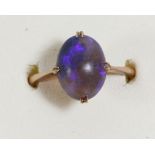 A 9ct gold and cabochon black opal ring, 12 x 8mm, black/blue colour, R, 2.8gm