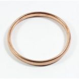 A 9ct rose gold slave bangle, Chester 1921, internal 22cm, 14.7gm