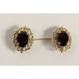 A pair of 9ct gold and garnet ear studs, 12 x 9mm, 1.7gm