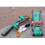 A Qualcast lawnmower (untested) together with a Black & Decker leaf blower with various