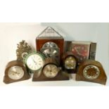 A Tempus Fugit wall hanging clock together with oak cased mantle clocks and others