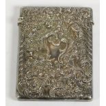 A Victorian silver card case, by William Comyns, London 1899, with embossed cherub decoration, 10