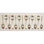 A silver set of eleven Old English pattern tea spoons, Sheffield 1910, monogramed, 244 gm,