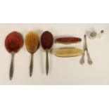 A silver mounted five piece dressing table set, Birmingham 1937, two silver topped jars and a pair