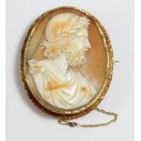 A Victorian gold mounted shell cameo brooch, carved to depict the God Zeus, chased border, crack, 50