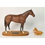 A Beswick model of a race horse 'Nijinsky' on wood plinth, 17cm tall, together with a Beswick