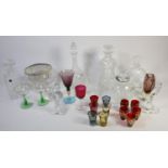 A collection of glassware to include, lead crystal decanters, cut glass flower vases, figural golf