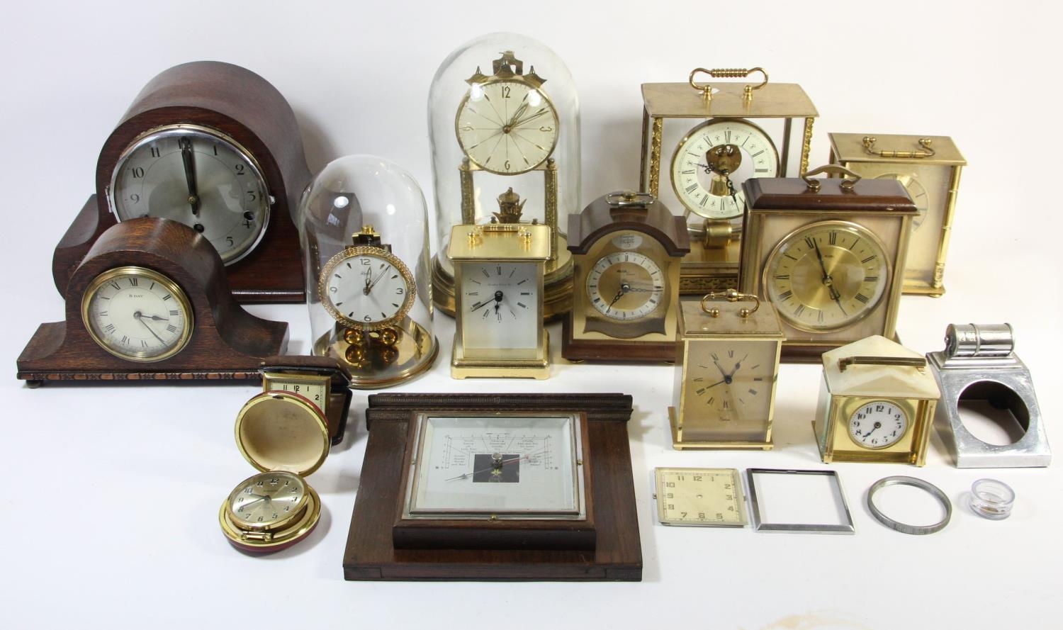 A Kundo brass electronic mantle clock, a German brass 400 day anniversary mantle clock, an Art