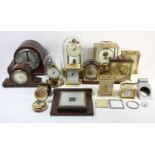 A Kundo brass electronic mantle clock, a German brass 400 day anniversary mantle clock, an Art