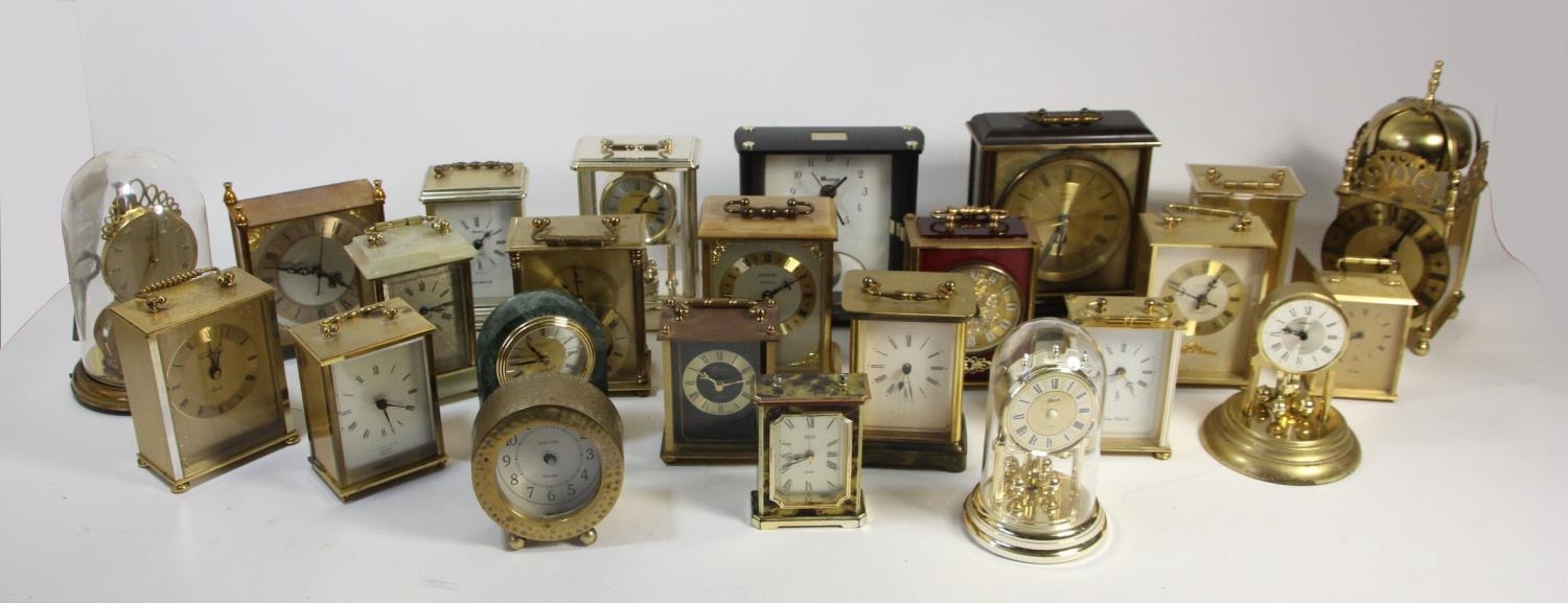 A collection of clocks to include, a Metamec electric clock, oak cased mantle clocks and quartz