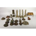 A collection of brass and copper ware to include, two pairs of candle sticks, miners lamps,