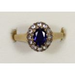 A 9ct gold sapphire and white stone cluster ring, O, 2.8gm