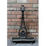 A Victorian cast iron umbrella stand, painted black with central flora design. H:68 W:48.