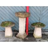 A pair of reconstituted stone two piece mushrooms, diameter 47cm and a sundial, 85cm (3)