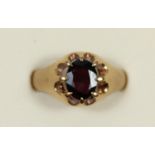 A 9ct rose gold and garnet single stone ring, T, 4.9gm