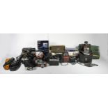 A collection of photography and camera equipment, including cameras, flash guns, movie cameras,