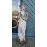 A reconstituted stone statue of a scantily clad Greek lady, 115cm