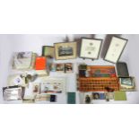 A collection of collectables, to include early 20th Century postcards, loose stamps, cigarette/tea