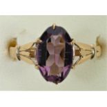 A 9ct gold and purple stone ring, size ( 1/2, chip to one end, 1.6gm