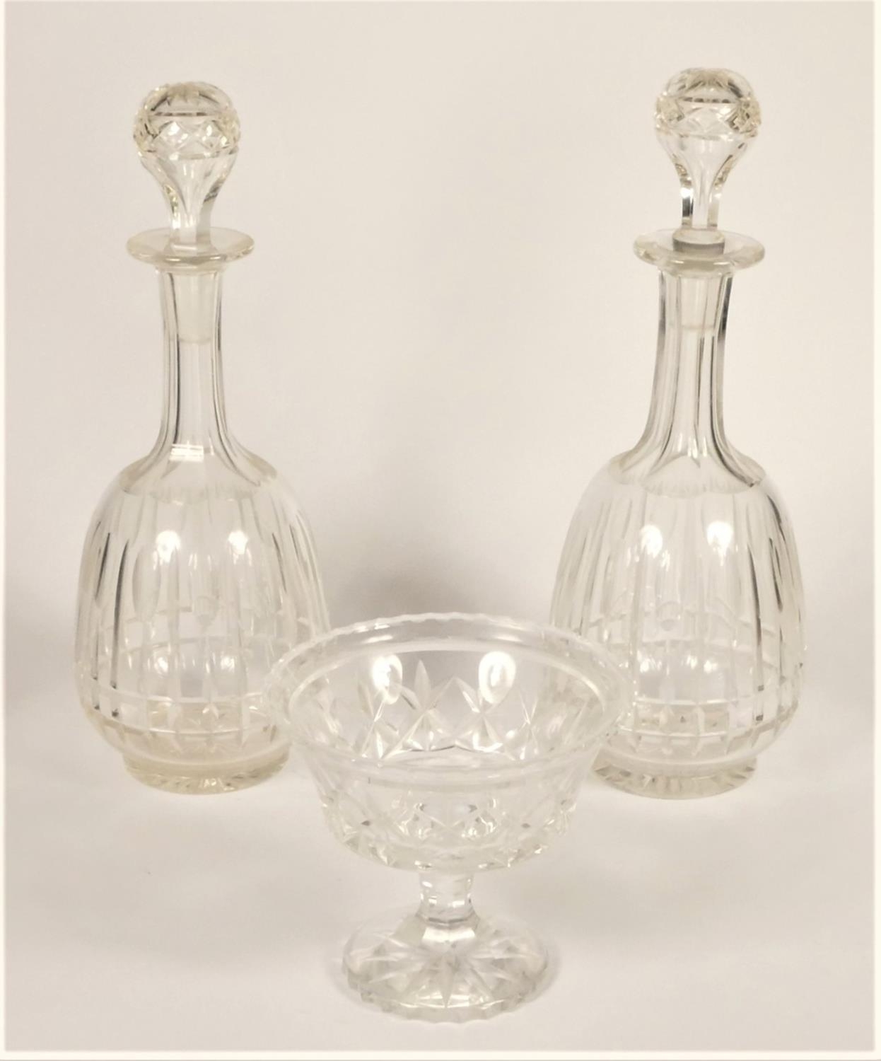 An Edwardian pair of cut glass decanters with ball stoppers, 31cm, together with a cut glass sweet