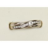 A 9ct white gold brilliant cut diamond channel set ring, O, 2.3gm