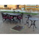 An impressive brown powder coated cast metal garden suite, comprising twin pedestal table, 180 x
